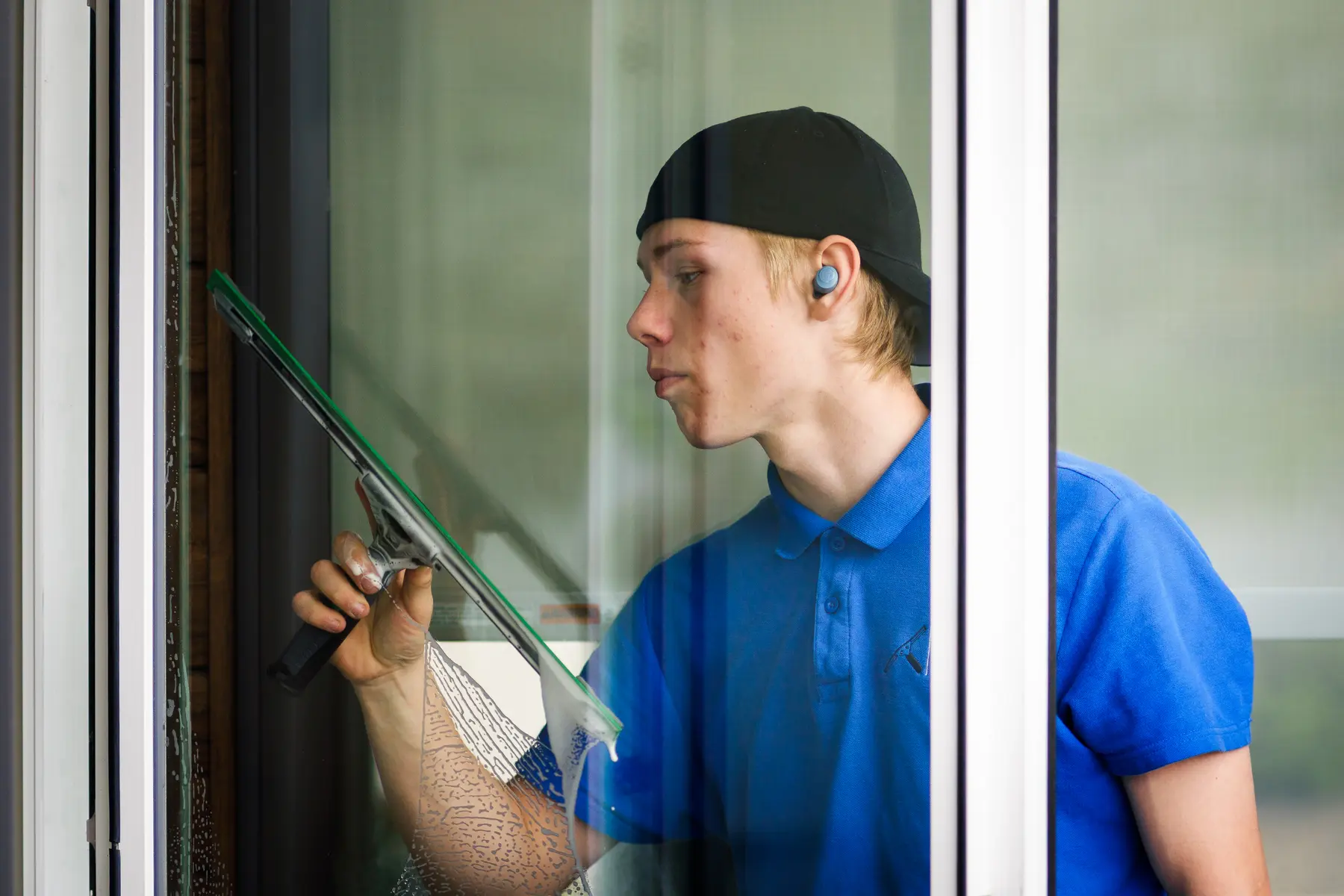 Vernon Clearview cleaning the inside of a residential window